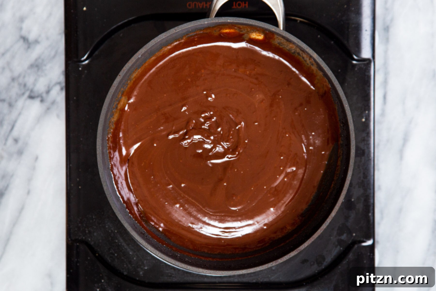 Decadent Mocha Swirl Cake 21 Smooth and rich vegan chocolate ganache in a saucepan, ready to be chilled and spread on the cake.