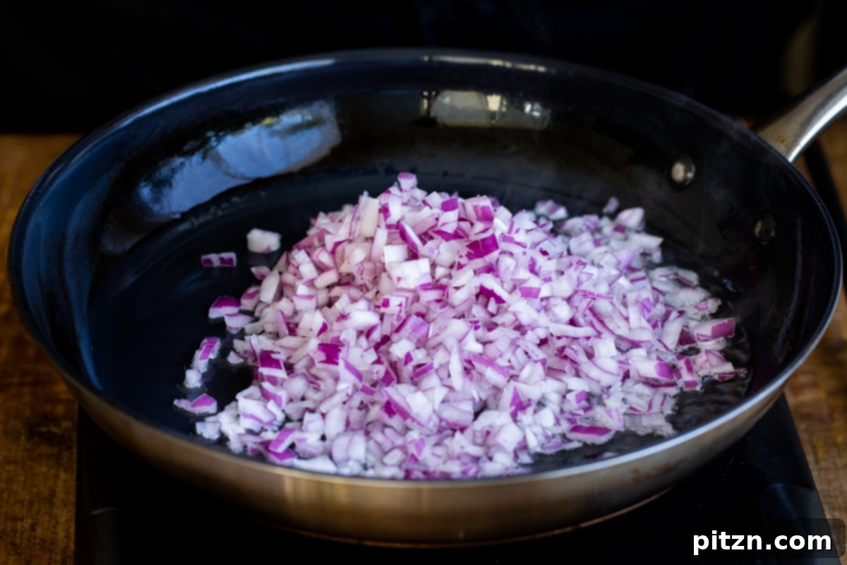 chopped onions in a black skillet 