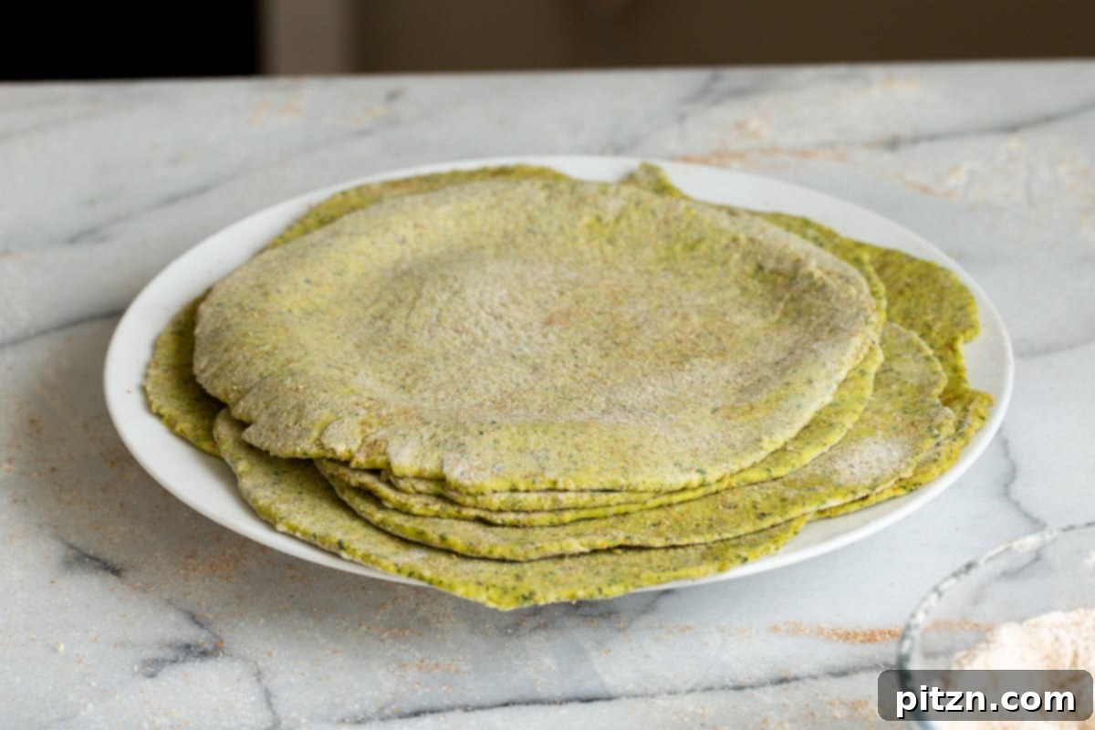 Aromatic Masala Paratha: Easy Yeast-Free Indian Flatbread 10 rolled out masala parathas on a white plate