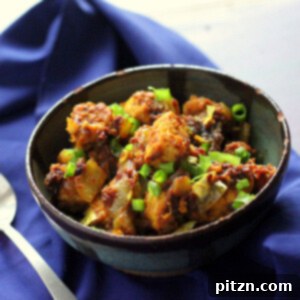 Vegan Glutenfree Kerala Tempeh Chili Roast 2 Keralan Tempeh Chili Roast in a black bowl on a blue cloth