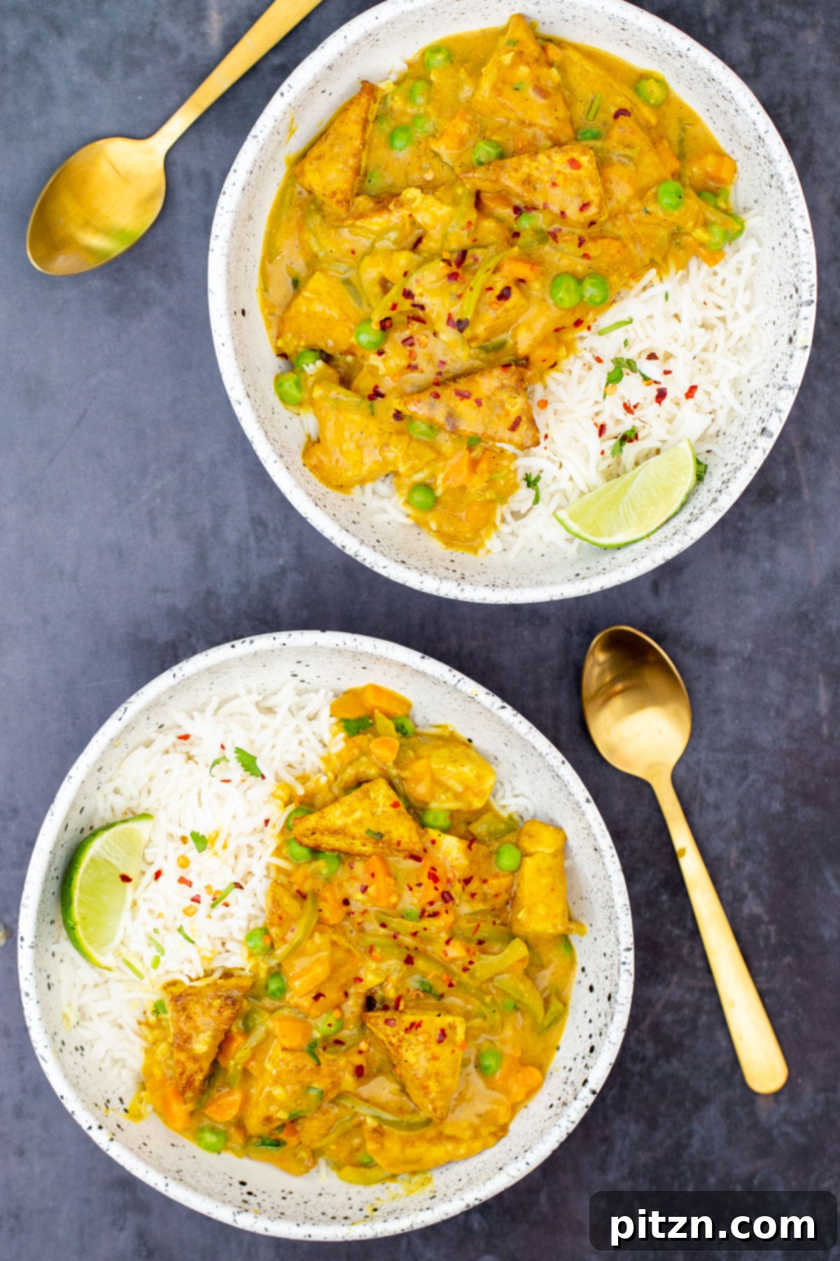 Vibrant Malaysian Tofu Curry 16 Two bowls with Malaysian tofu curry served with rice
