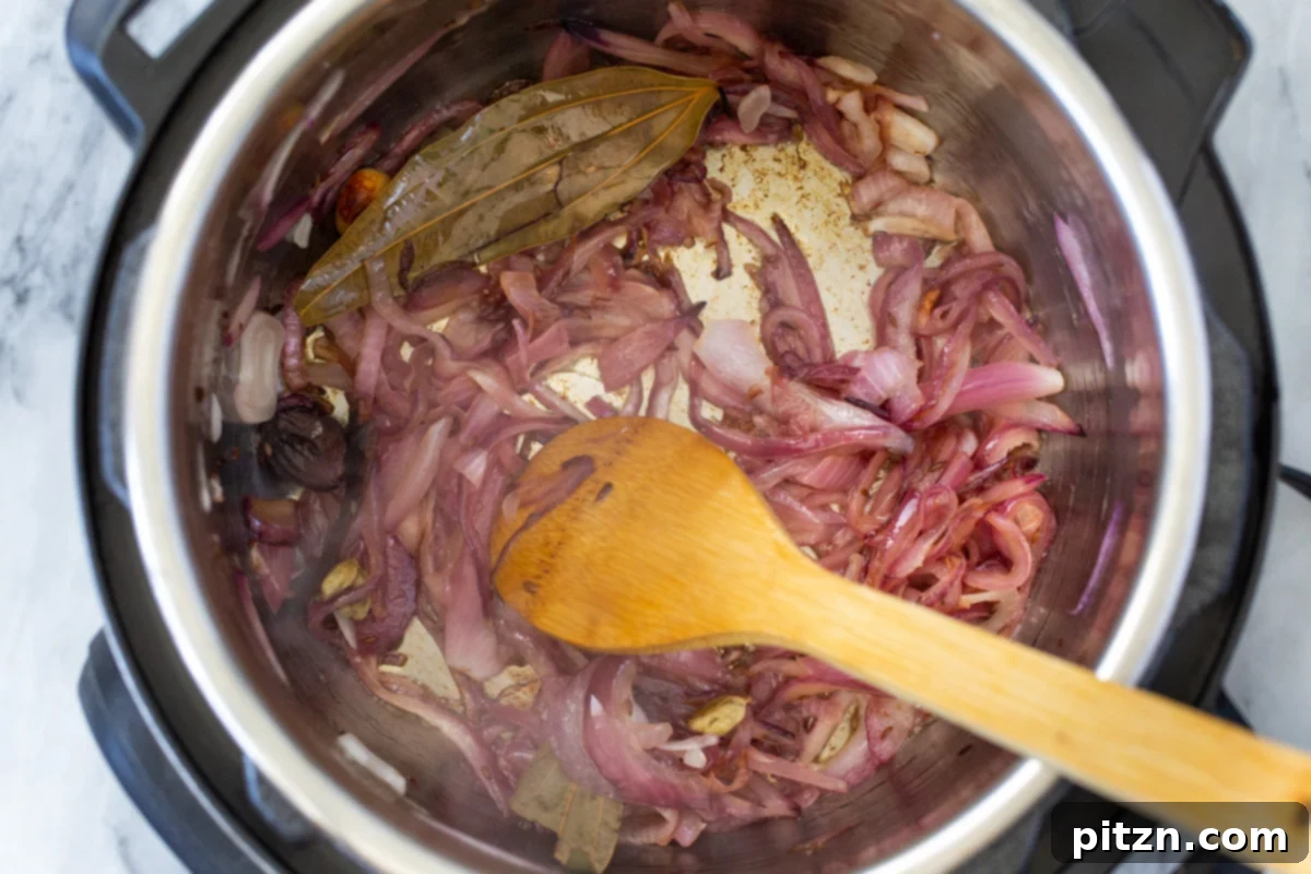 Fragrant Mushroom Biryani 12 Caramelizing onions and spices continue to cook in an Instant Pot, deepening their flavor and color.