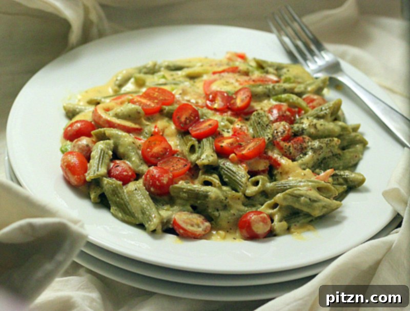 Overhead shot of a bowl of Spinach Penne with Red Bell Peppers, ready to be enjoyed