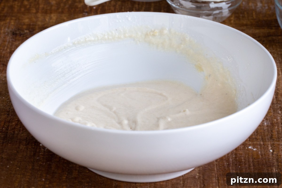 Spinach and Mushroom Stuffed Almond Flour Naan 11 Gluten-free vegan naan batter in a white bowl, showing the desired consistency