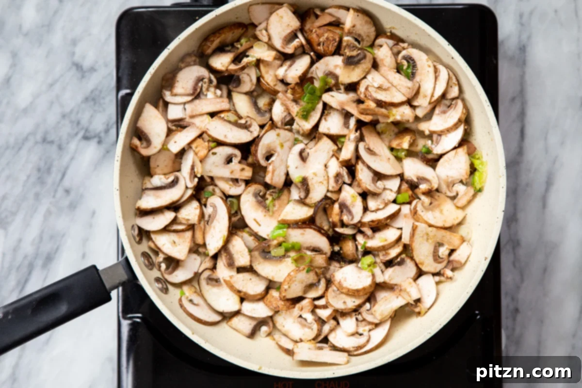 Spinach and Mushroom Stuffed Almond Flour Naan 15 Closer view of mushrooms and green onions sautéing, becoming tender