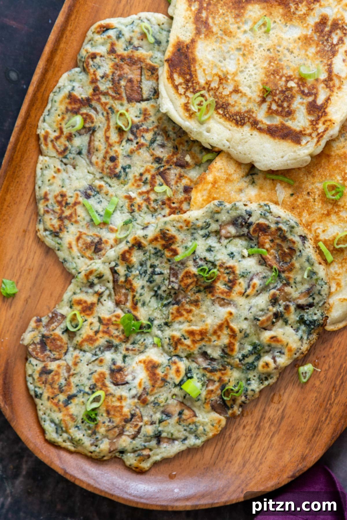 Spinach and Mushroom Stuffed Almond Flour Naan 6 Gluten-free vegan naan stuffed with spinach and mushrooms, ready to serve.