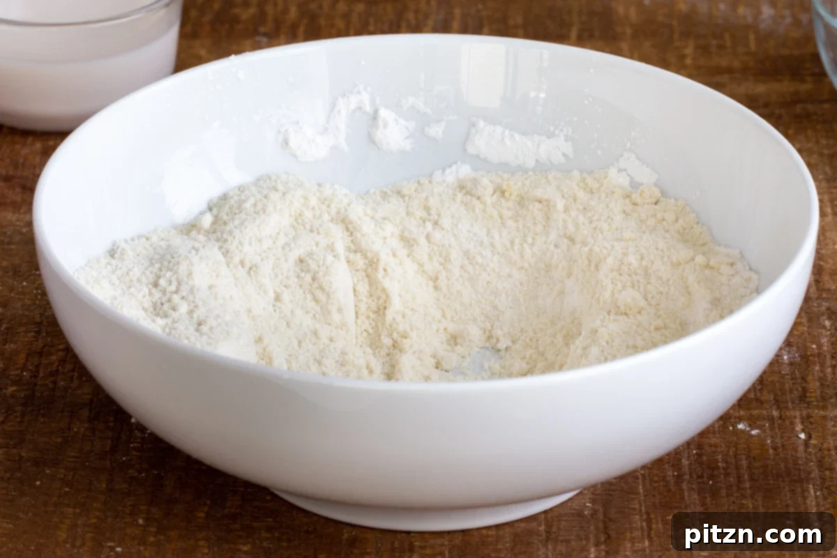 Spinach and Mushroom Stuffed Almond Flour Naan 9 Dry ingredients for vegan naan bread in a white bowl, ready for mixing