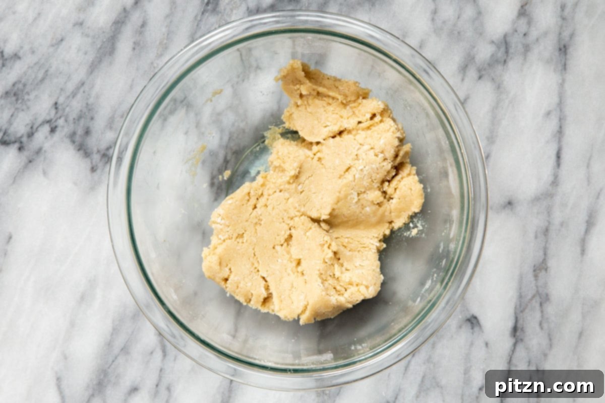 Irresistible Vegan Gluten-Free Almond Coconut Joy Cookies 10 Finished vegan Almond Joy cookie dough resting in a glass bowl, perfectly mixed and ready for shaping