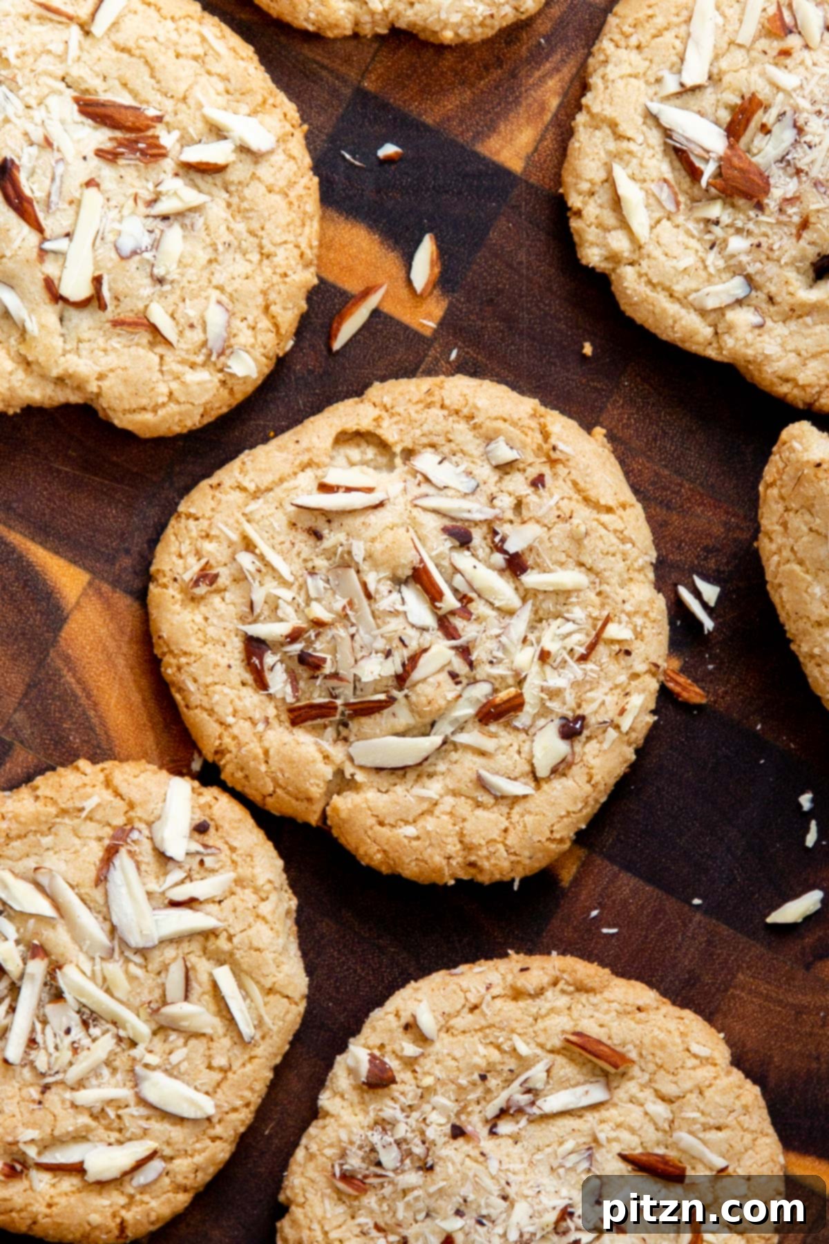 Irresistible Vegan Gluten-Free Almond Coconut Joy Cookies 6 Gluten-free vegan Almond Joy cookies artfully arranged on a wooden board, highlighting their enticing appearance