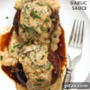 Succulent Grilled Portobello Mushrooms generously coated in a rich Garlic Sauce, perfect when grilled or baked and served with creamy gravy.
