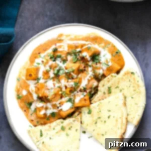 Delicious Tofu Malai Curry served with rice and bread, a simple Indian weeknight curry with tofu in a thick spiced coconut milk gravy.