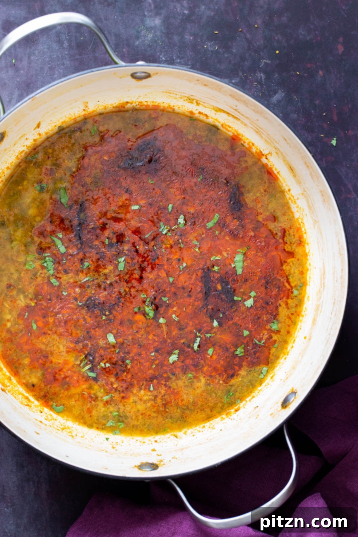 Chataka Dal: Spicy Maharashtrian Toor Dal 3 Indian Chataka Dal gently simmering in a vibrant green and white saucepan, the lentils creamy and aromatic, ready for the final tempering. This image captures the essence of homemade Maharashtrian cooking.