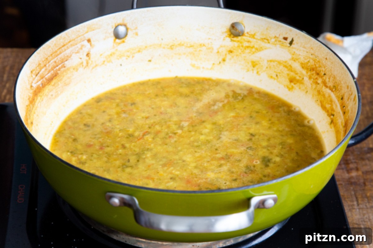 Chataka Dal: Spicy Maharashtrian Toor Dal 9 Chataka Dal gently simmering in a saucepan on the stove, reaching its perfect creamy texture and aromatic consistency, almost ready for the tadka.