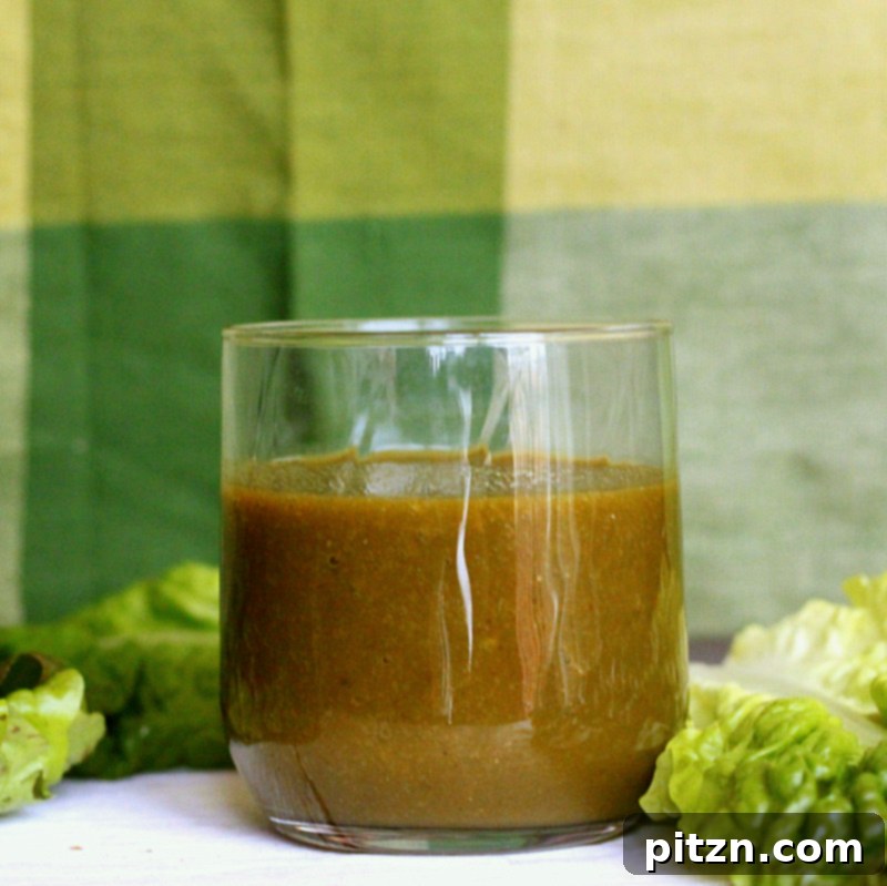 A close-up shot of a refreshing green smoothie in a glass, ready to be enjoyed.
