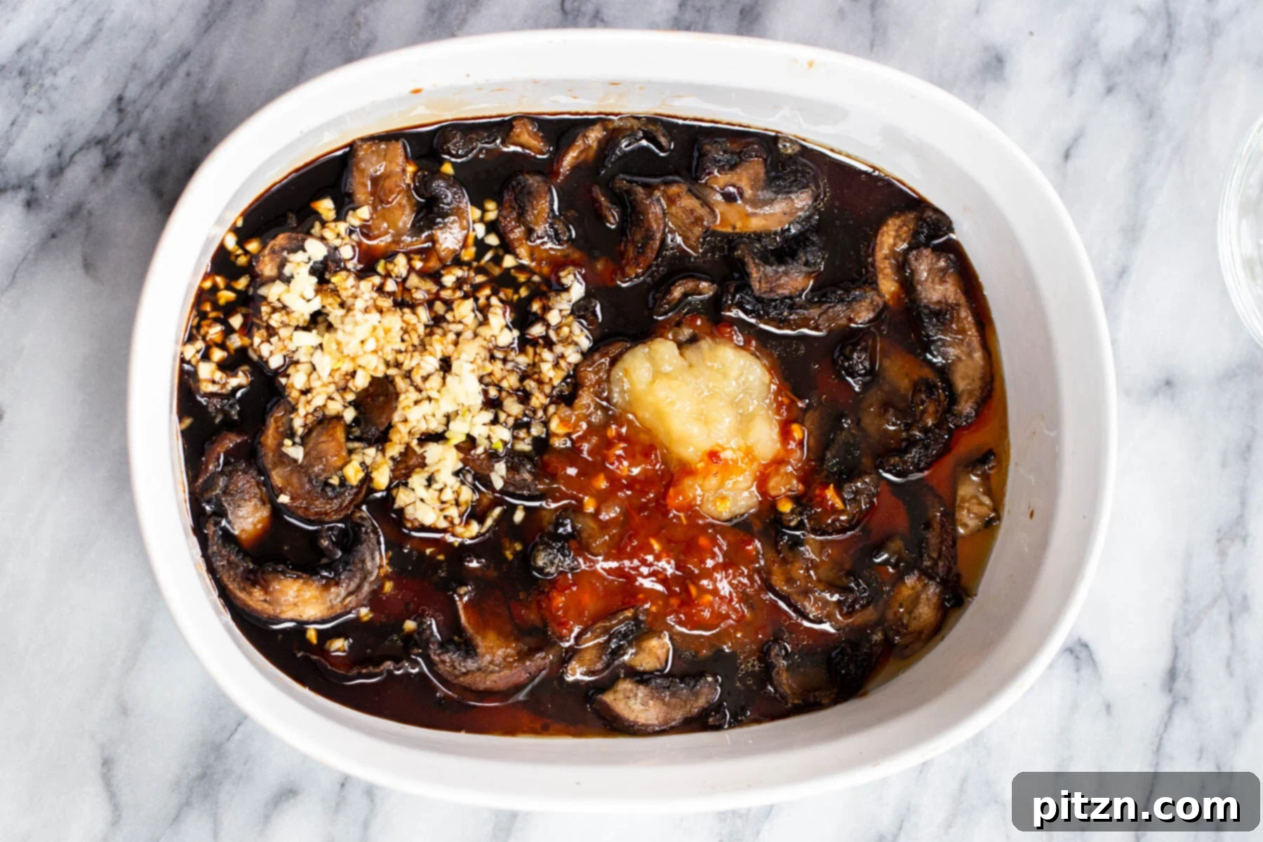 Sesame Glazed Mushrooms 11 A casserole dish with baked sticky sesame mushrooms
