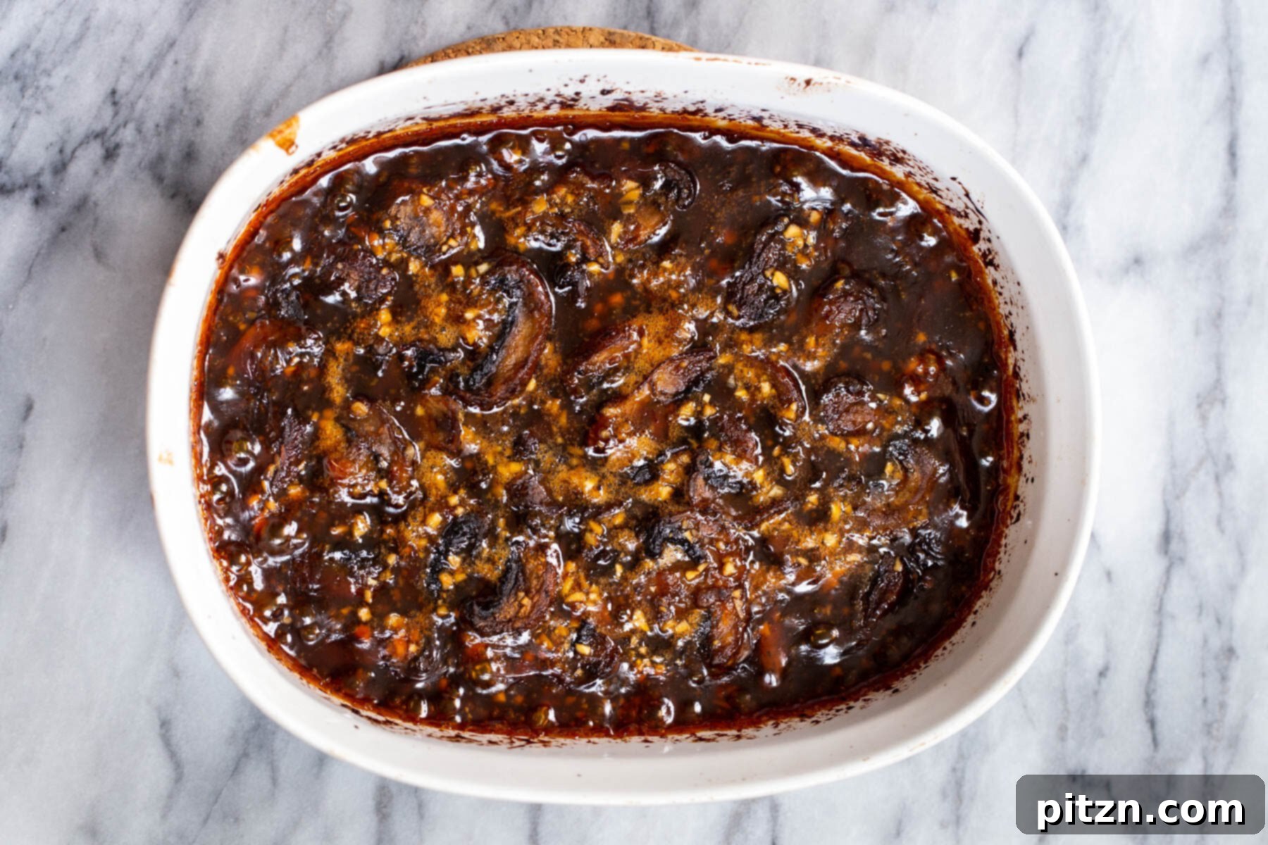 Sesame Glazed Mushrooms 12 Casserole dish with sliced sticky sesame mushrooms