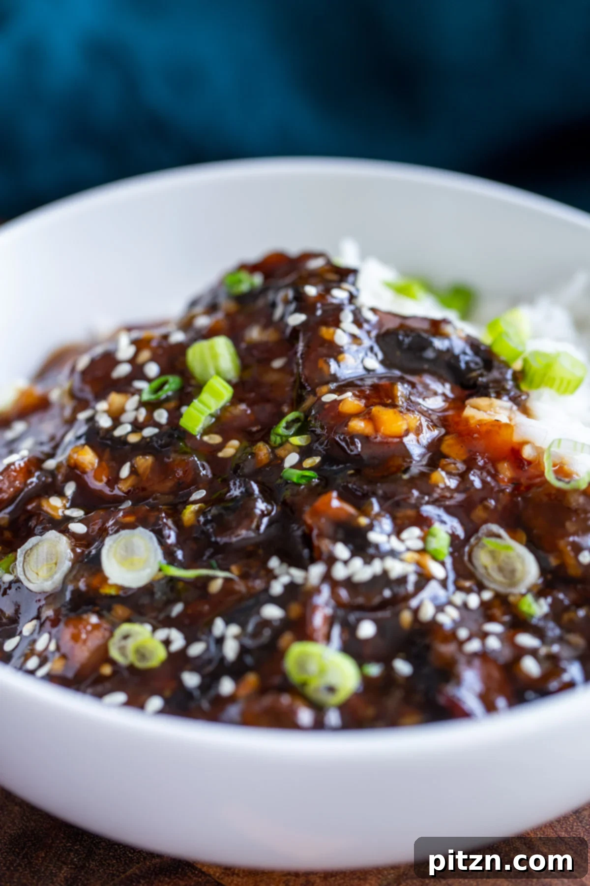 Sesame Glazed Mushrooms 3 Sticky sesame mushrooms served with rice and sprinkled with sesame seeds and green onions