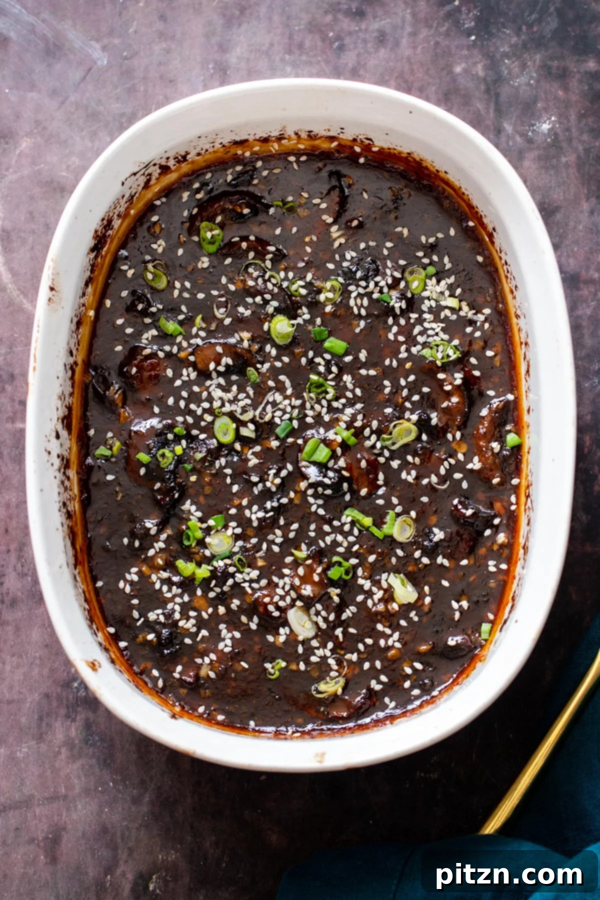 Sesame Glazed Mushrooms 4 A casserole dish with baked sticky sesame mushrooms