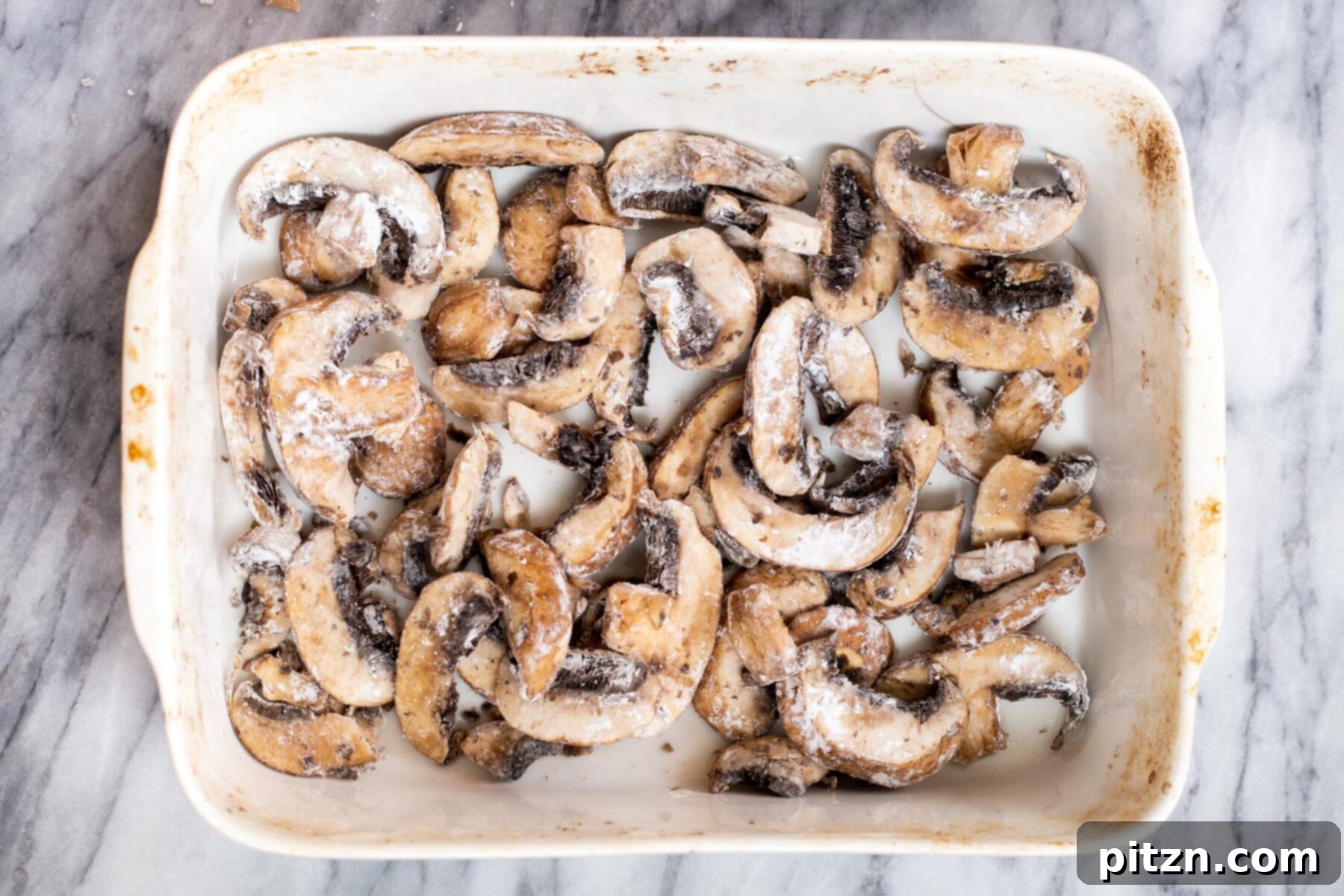 Sesame Glazed Mushrooms 8 Cornstarch coated mushroom slices in a casserole dish