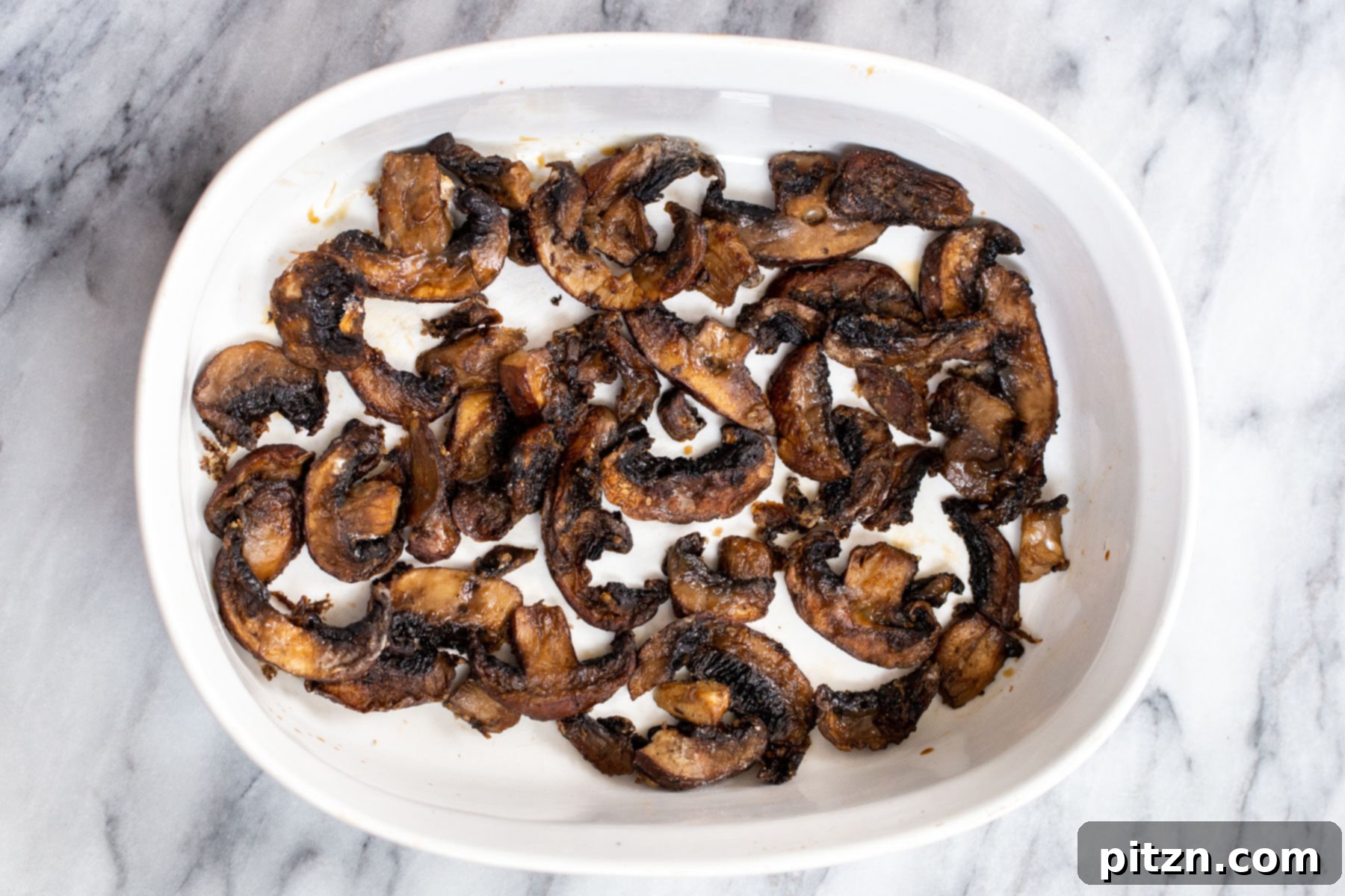 Sesame Glazed Mushrooms 9 Baked mushroom slices in a casserole dish