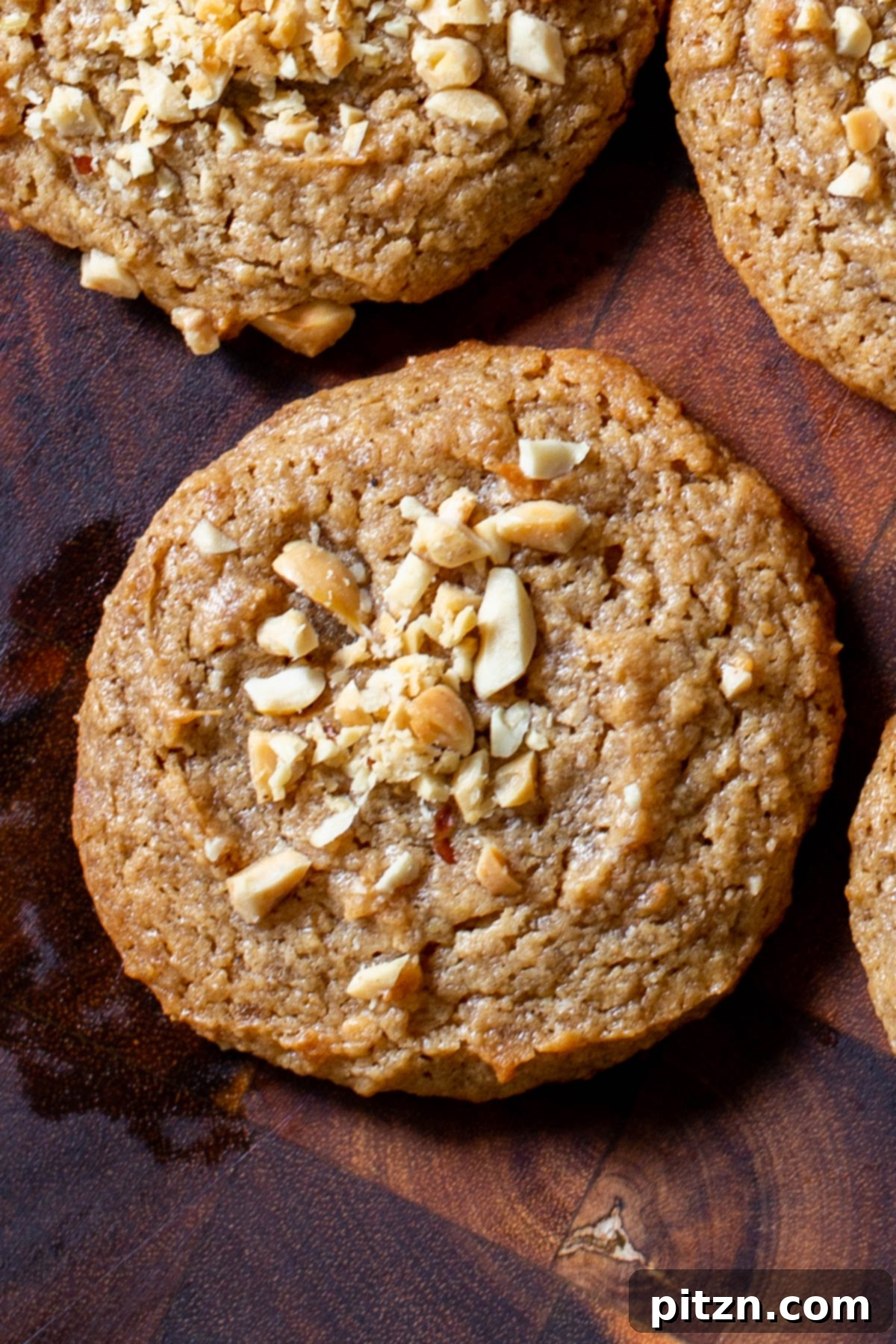 Flourless Peanut Butter Cookies 14 A wooden board laden with an inviting spread of vegan no-flour peanut butter cookies, capturing their rustic appeal and rich texture.
