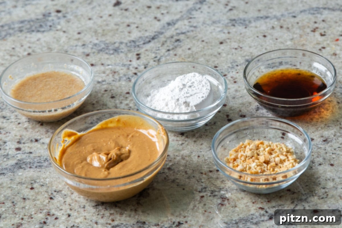 Flourless Peanut Butter Cookies 6 A vibrant flat lay showcasing all the ingredients required for making vegan no-flour peanut butter cookies, neatly arranged on a light surface.