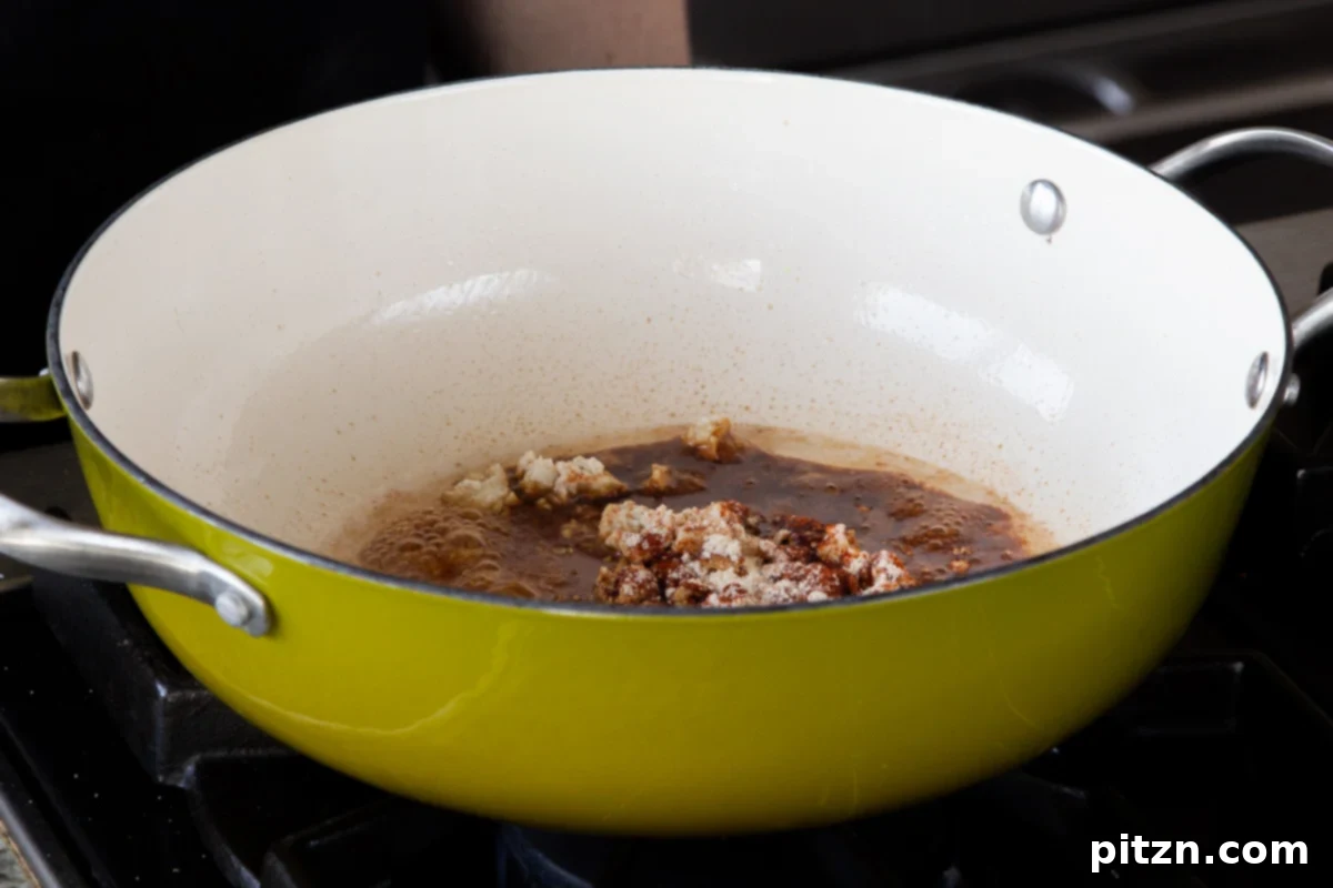 Fireside Smoked Potato Soup 7 Pan of crumbled tofu with maple syrup, soy sauce, smoked paprika, and garlic powder added, ready to be cooked