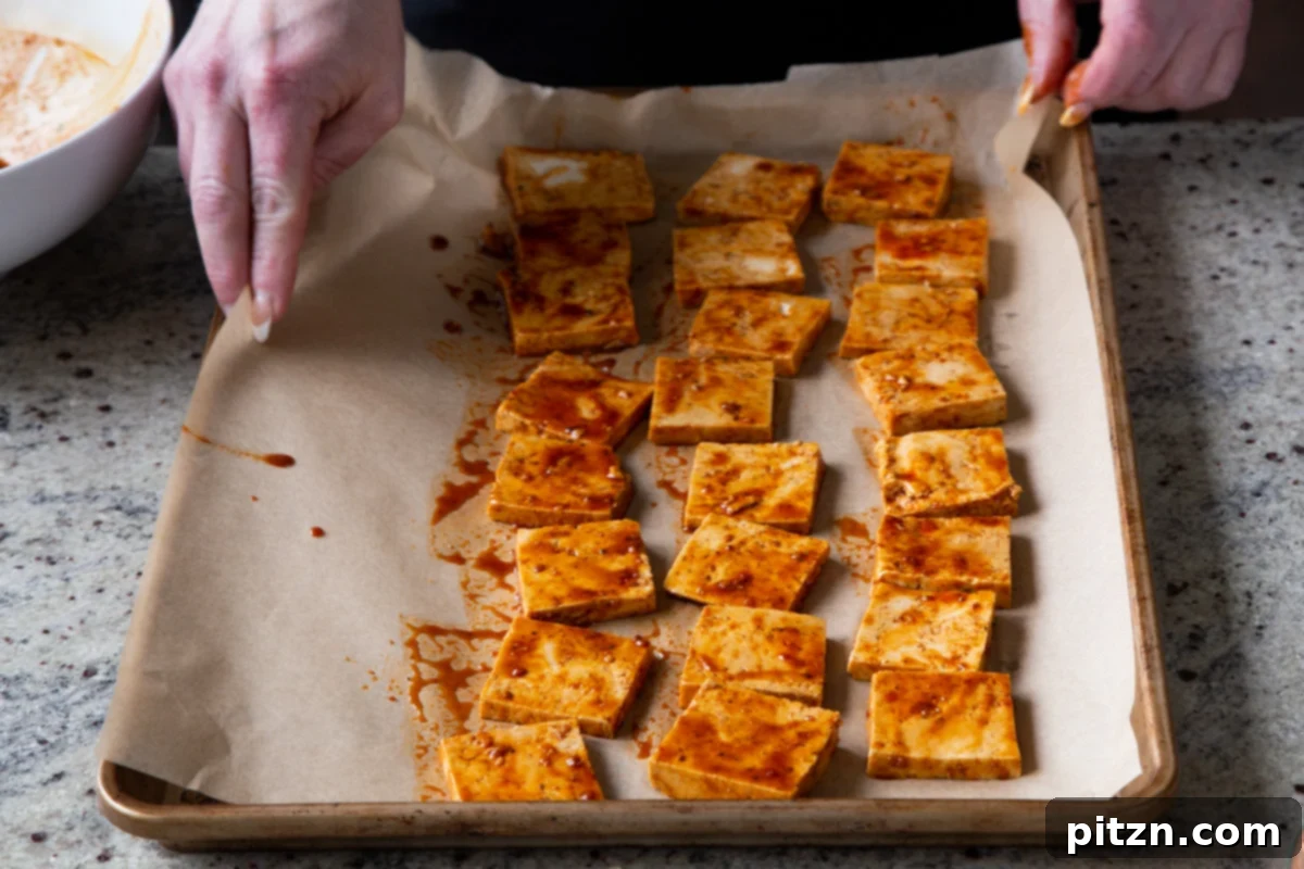 Spicy Gochujang Tofu Sandwich 11 Gochujang tofu on the baking sheet before baking, arranged for even crisping.