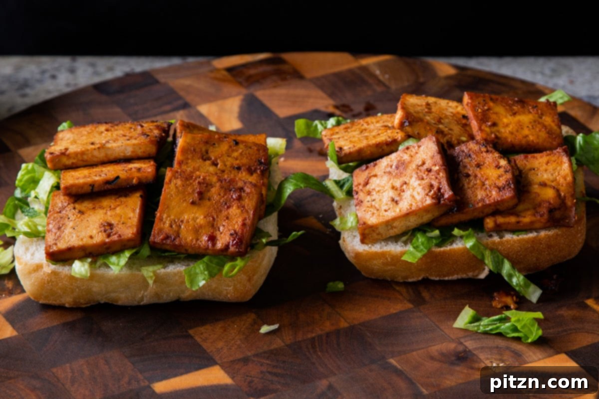 Spicy Gochujang Tofu Sandwich 17 Tofu added to the ciabatta rolls, building the sandwich layers.