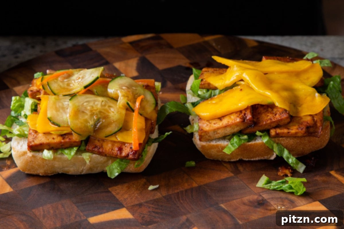 Spicy Gochujang Tofu Sandwich 18 Mango and pickles added to the tofu sandwich, creating a colorful and flavorful stack.
