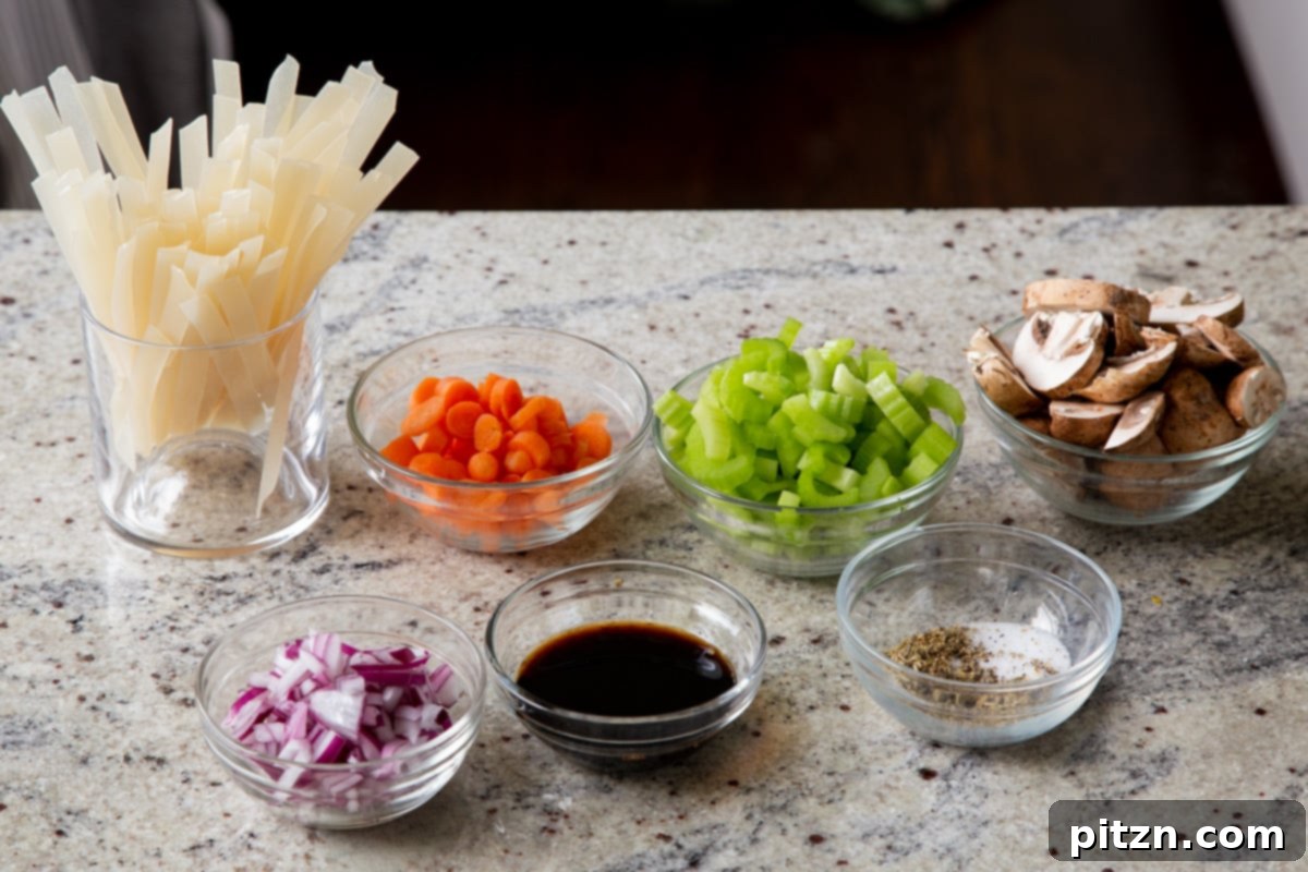 Hearty One-Pot Mushroom Noodle Delight 7 Bowls of fresh ingredients including mushrooms, noodles, various vegetables, and seasonings laid out on a kitchen counter, ready for cooking.