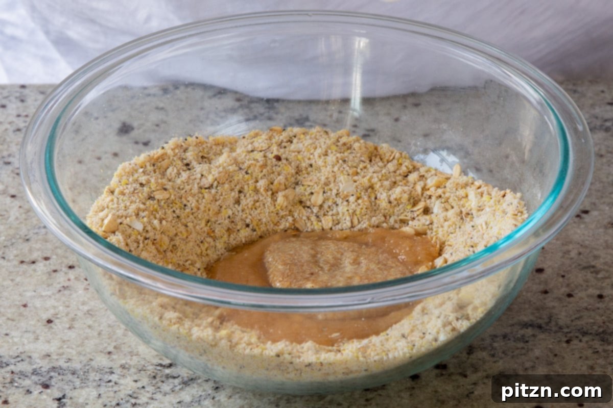 Doritos Nacho Crunch Bars 10 Combining wet ingredients with the dry in a mixing bowl