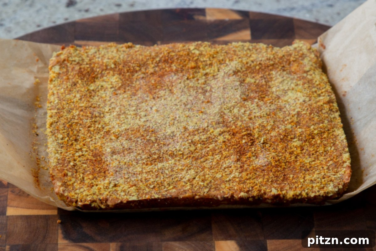 Doritos Nacho Crunch Bars 16 Savory granola bars cooling in the pan before being sliced