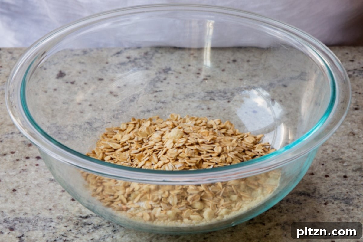 Doritos Nacho Crunch Bars 7 Adding oats to the almond flour in a mixing bowl