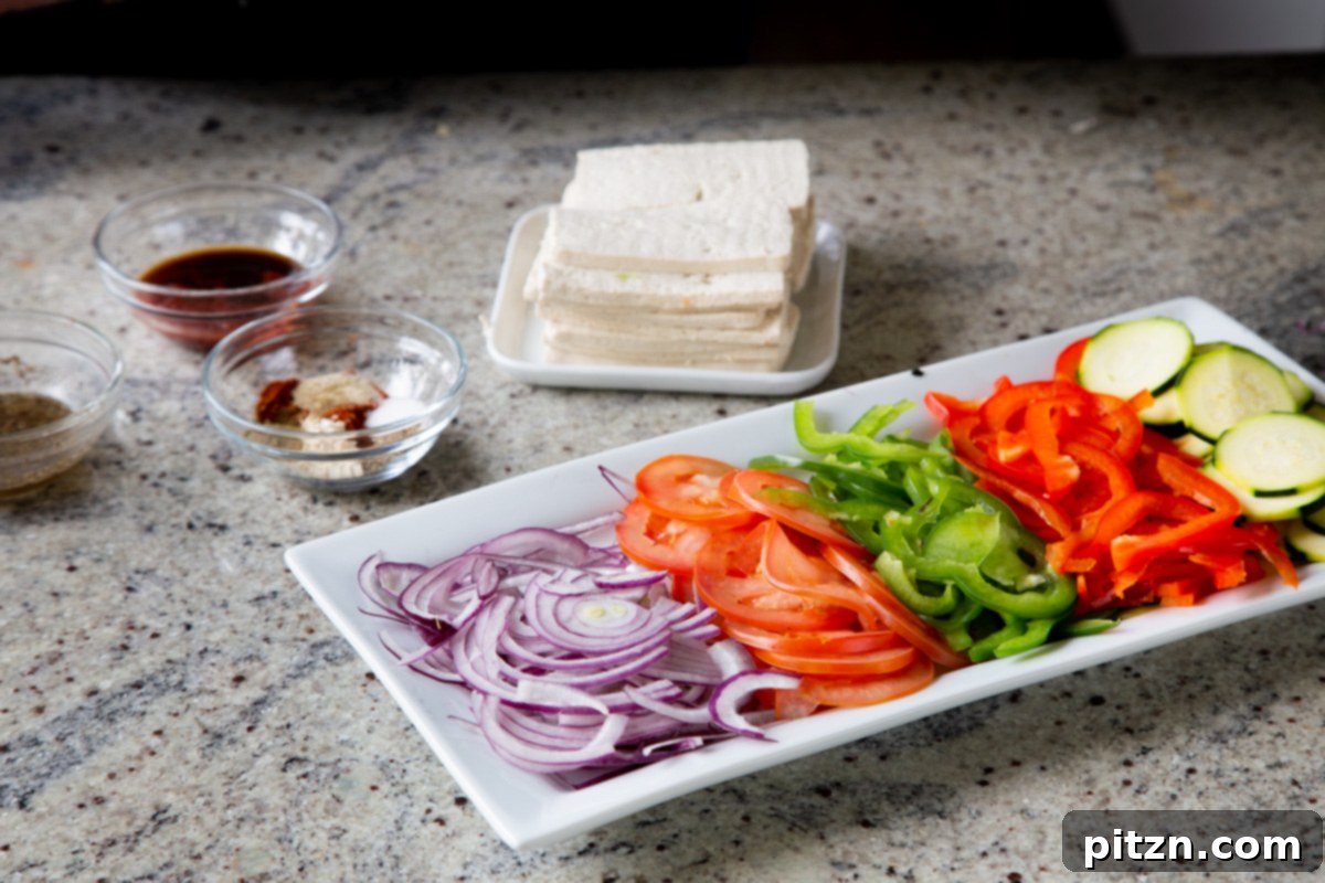 Plant-Based Deli Club 6 Various ingredients for the vegan club sandwich, including tofu, fresh vegetables, and spices, neatly arranged on a kitchen counter.
