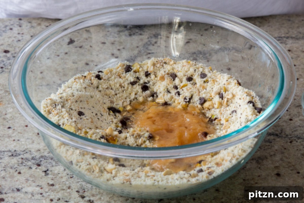 Perfectly Crisp Granola Bars 12 adding wet ingredients to the mixed dry ingredients