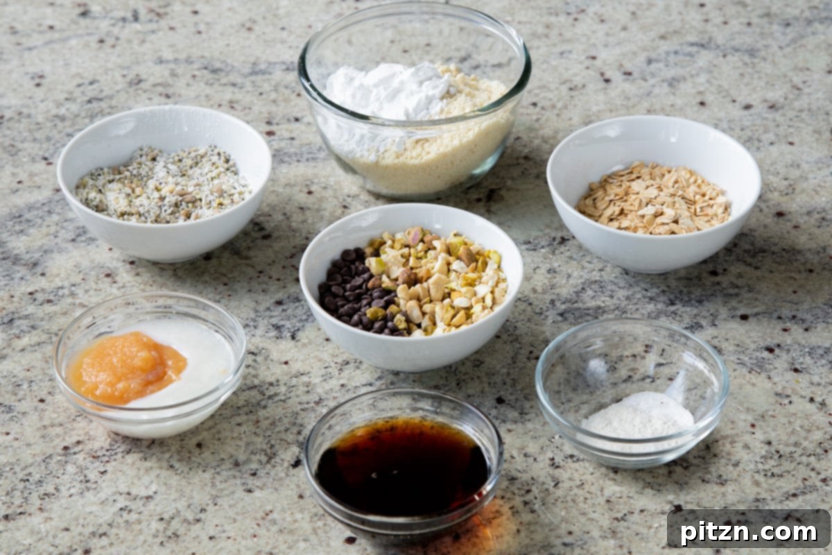 Perfectly Crisp Granola Bars 6 almond flour, nuts, seeds, chocolate, and other baking ingredients on a kitchen counter