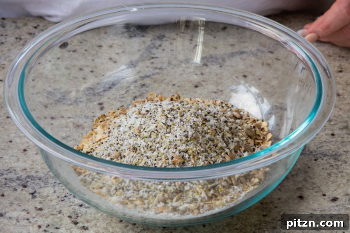 Perfectly Crisp Granola Bars 9 adding seeds to the mixing bowl