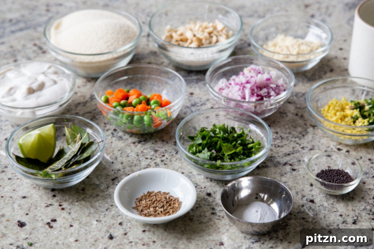Bowls of semolina flour, chopped vegetables like carrots, peas, and onion, along with various spices and herbs, neatly arranged on a kitchen counter, ready for making Rava Idli Waffles.