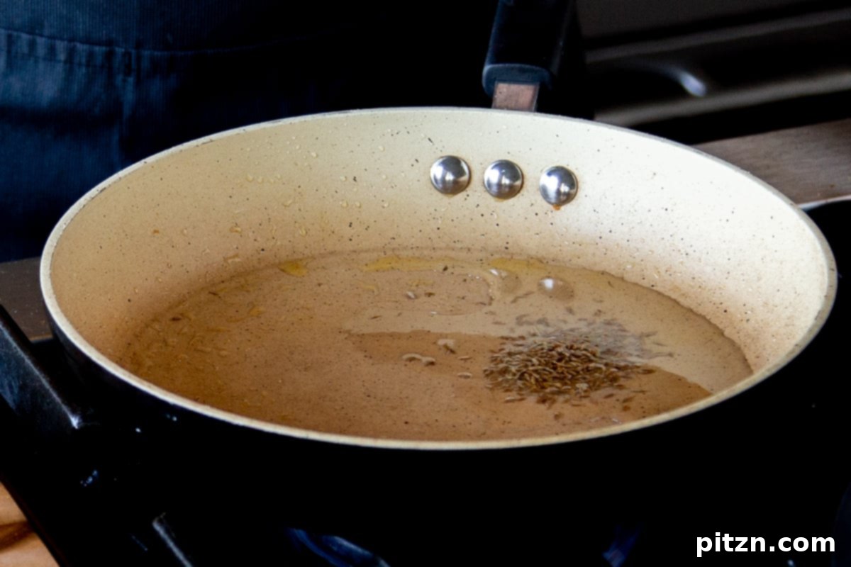 North Indian Restaurant Bhuna: A Vegetarian Curry Classic 15 toasting cumin seeds and bay leaf in hot oil for the tadka topping