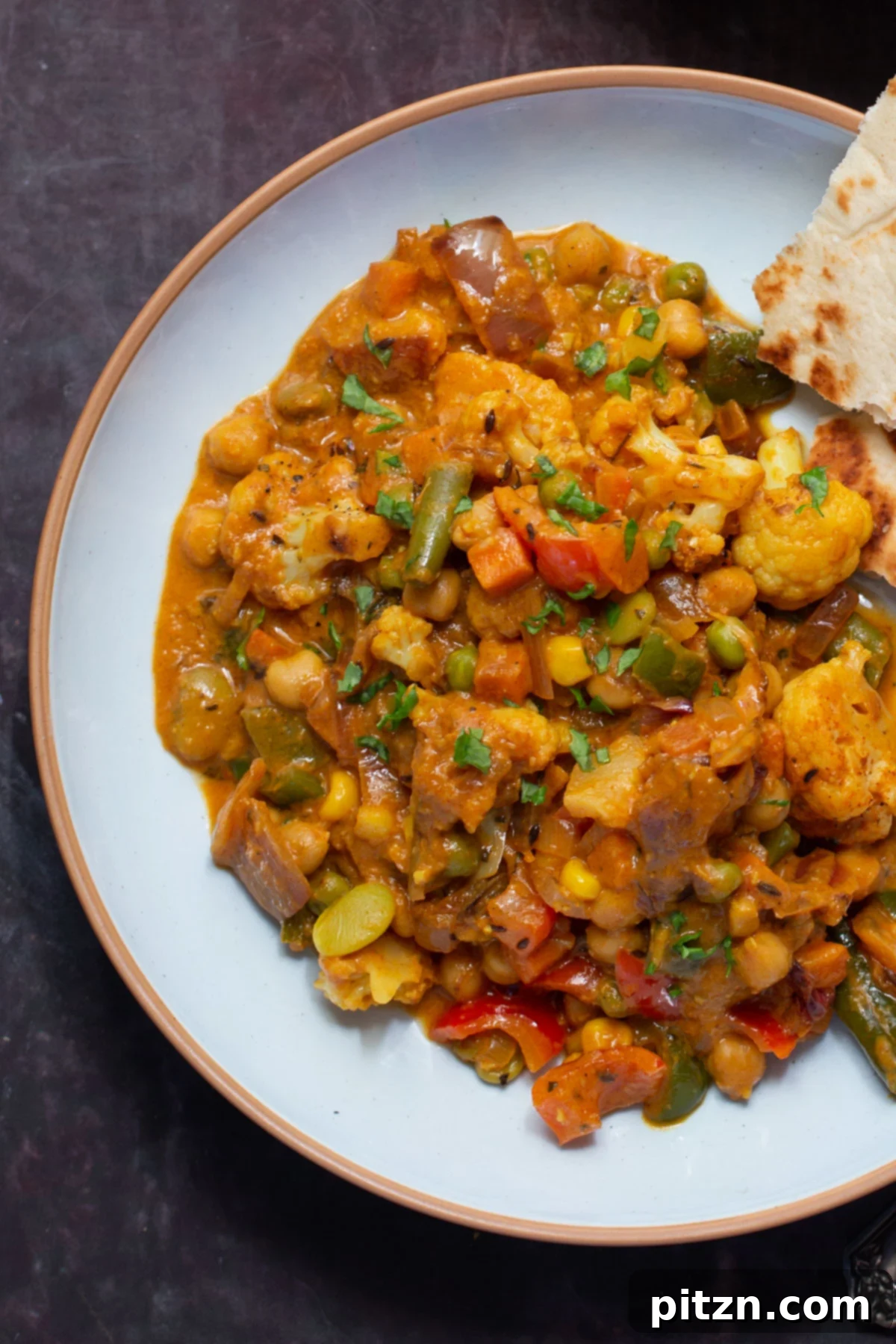 North Indian Restaurant Bhuna: A Vegetarian Curry Classic 4 close-up view of vegetable bhuna on a plate, showing rich texture and vibrant colors