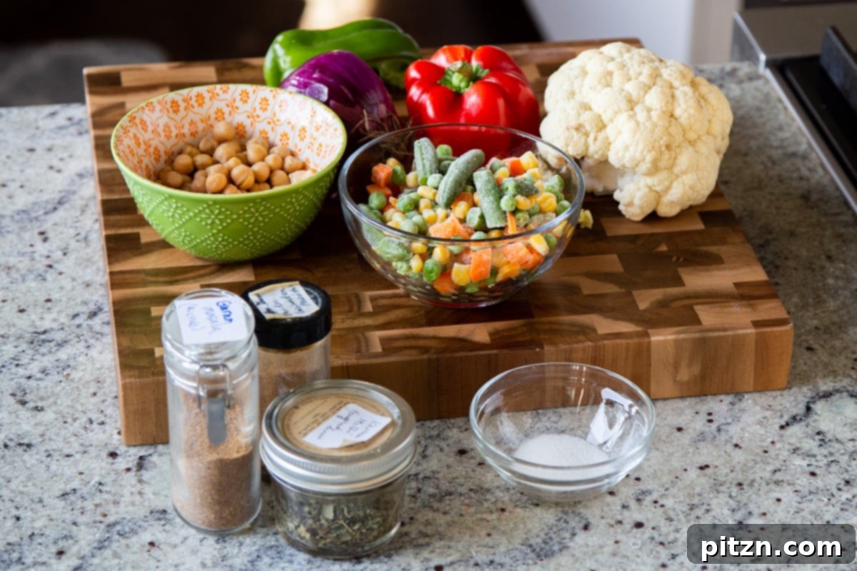 North Indian Restaurant Bhuna: A Vegetarian Curry Classic 6 assortment of vegetables, spices, and other bhuna ingredients artfully arranged in bowls on a kitchen counter