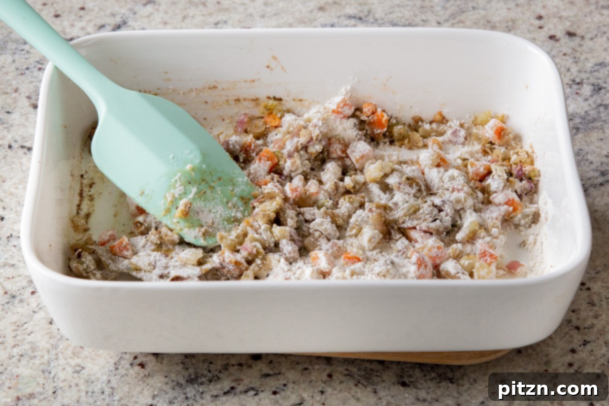 Everything Bagel Pot Pie Remix 12 Flour thoroughly mixed into the vegetable base in the baking pan, ready for the liquid
