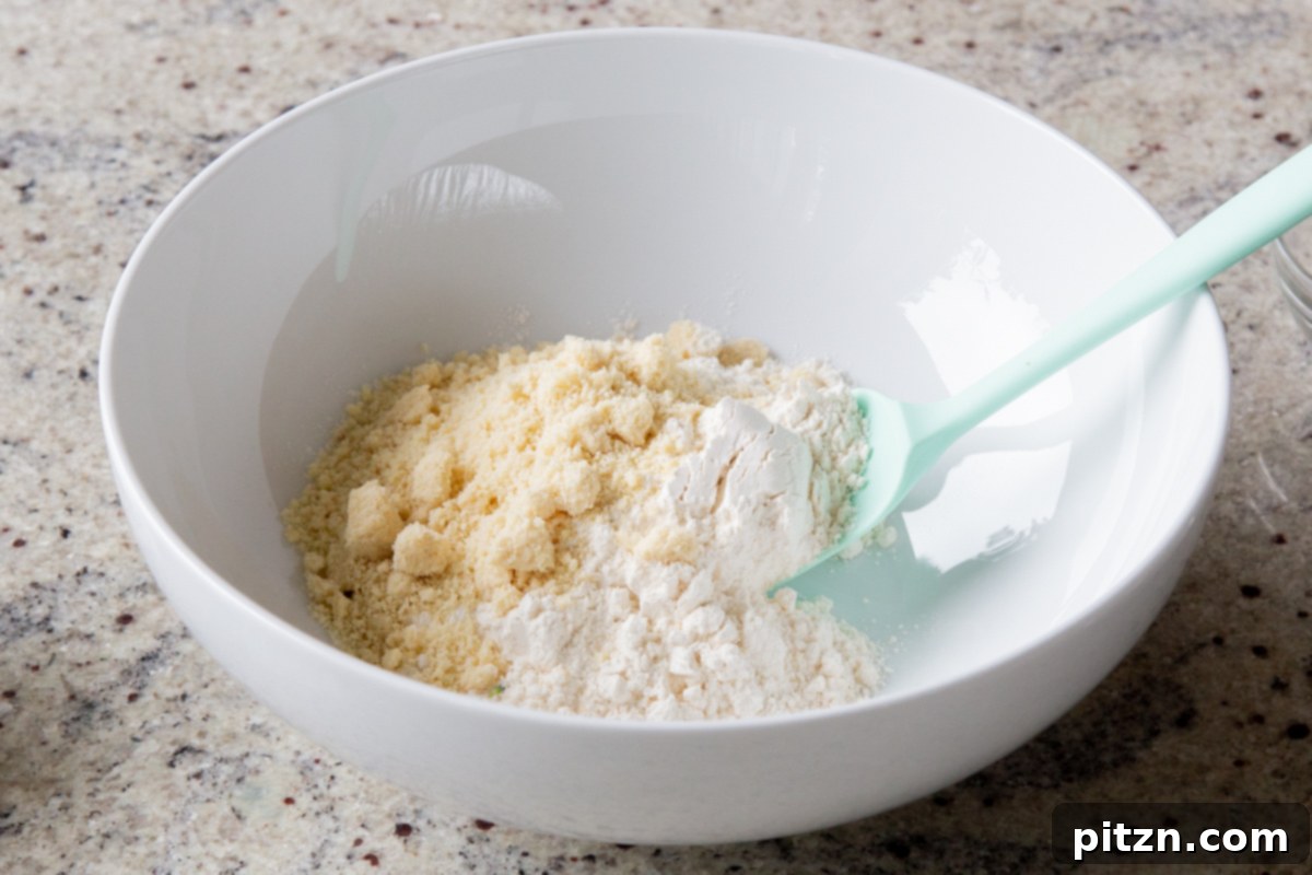 Everything Bagel Pot Pie Remix 17 Dry ingredients for the biscuit topping in a mixing bowl, including flours and seasonings