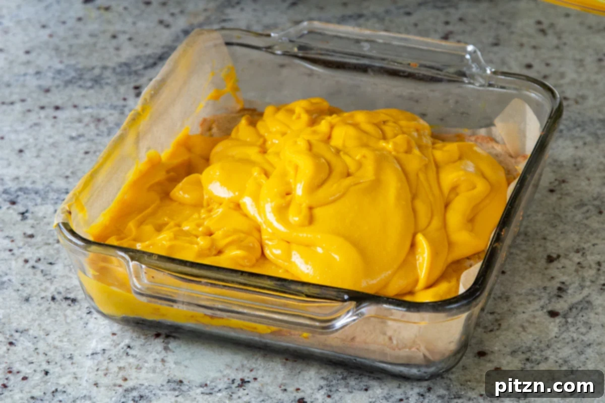 blended mango custard layered onto the crust, before spreading out
