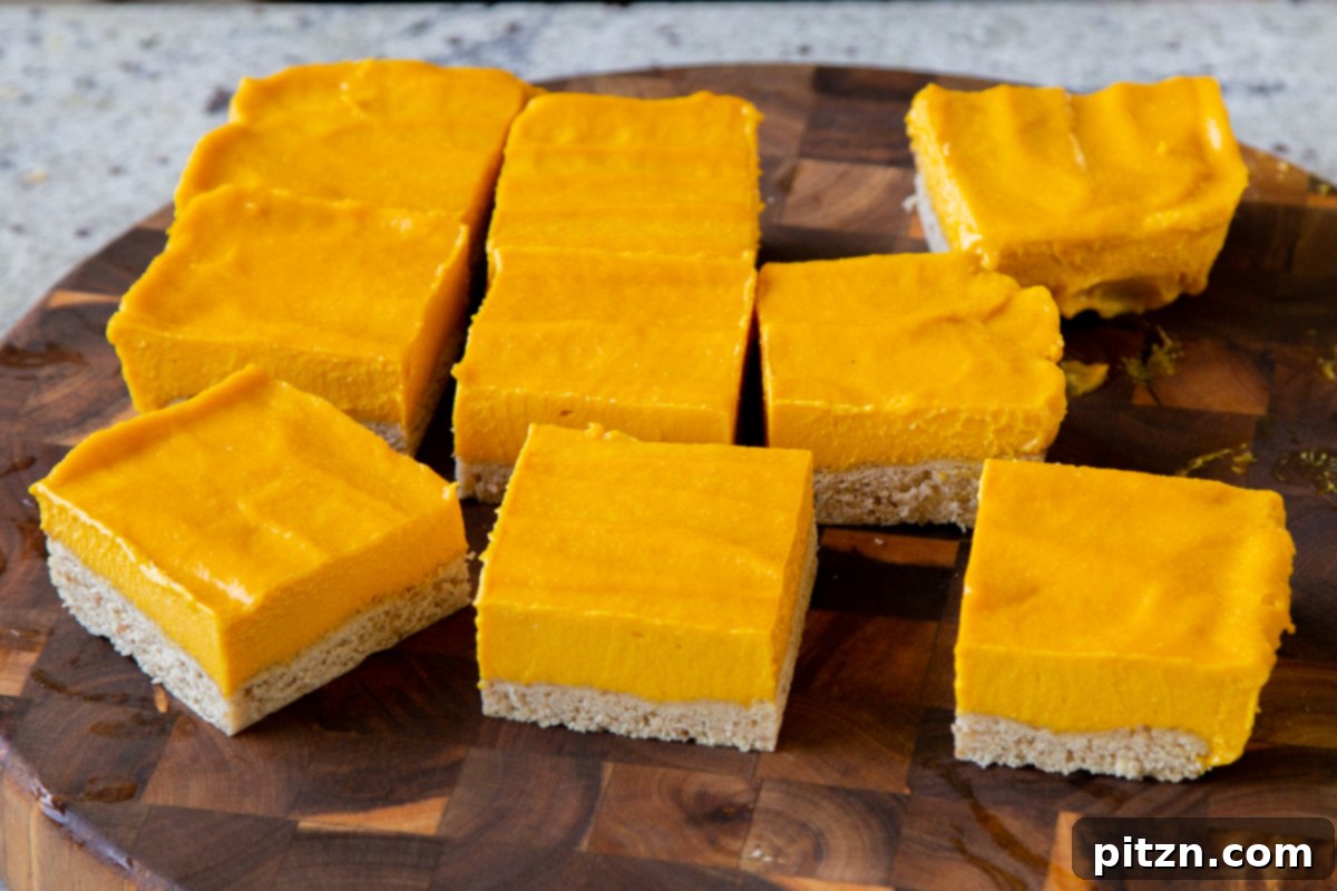mango squares, all sliced up on a cutting board