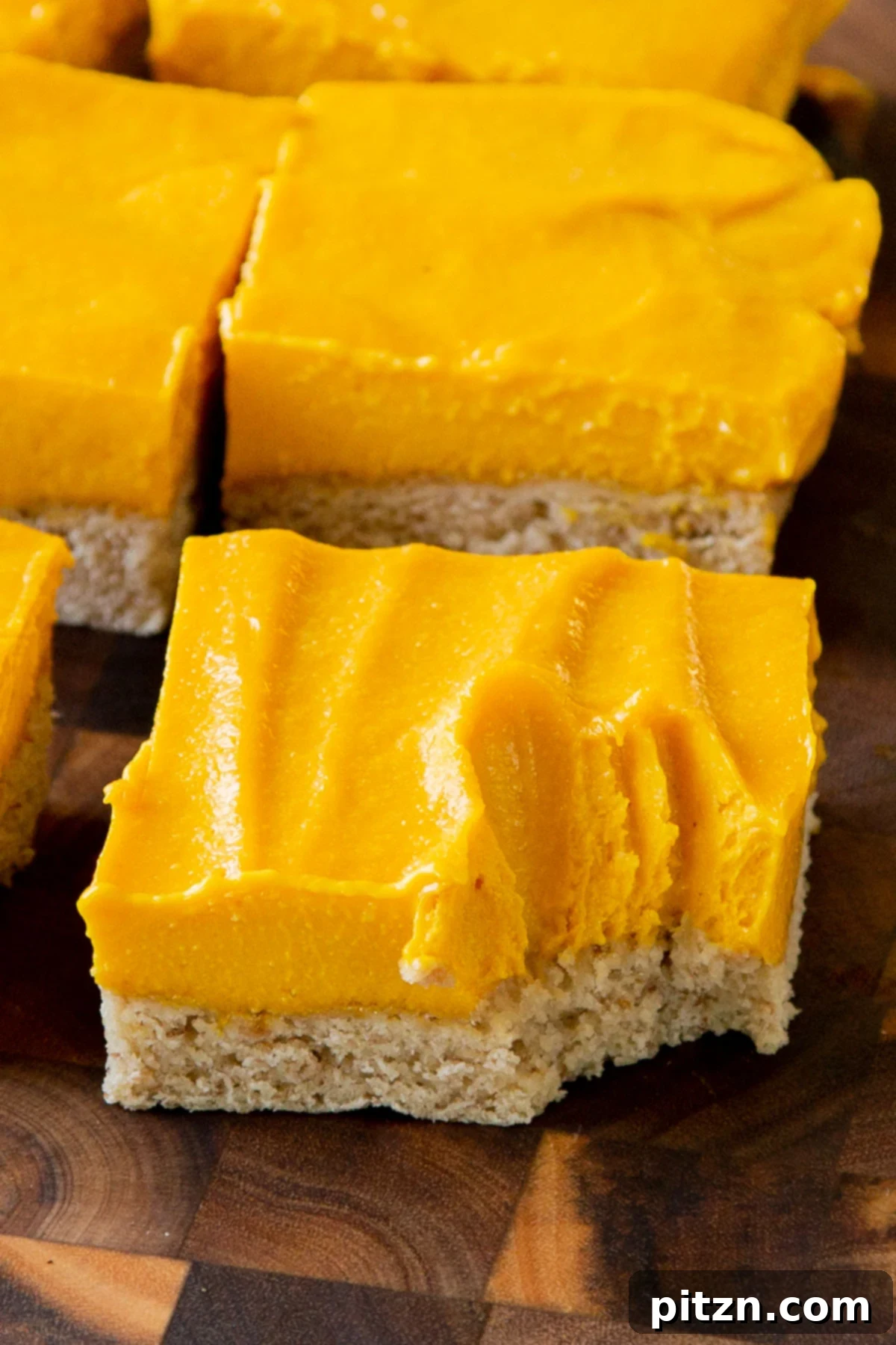 close-up of a mango bar with a bite taken out, so you can see the texture