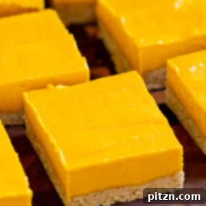close-up of sliced mango bars on a cutting board