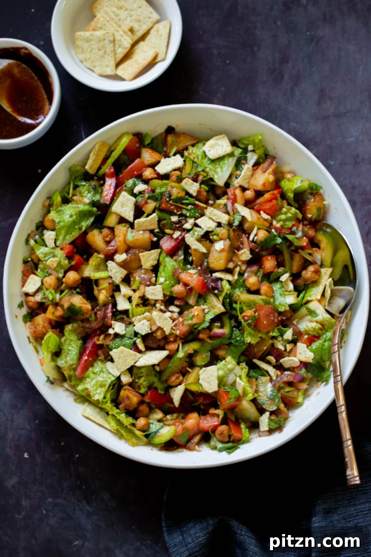 Smoky Chickpea Potato Salad 4 A beautifully presented BBQ chickpea and potato salad in a serving bowl, ready to be enjoyed at a summer gathering.