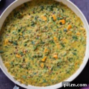 panful of lentil coconut curry on a slate table